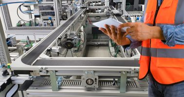 Engineers use technology to control production machinery in industrial plants.